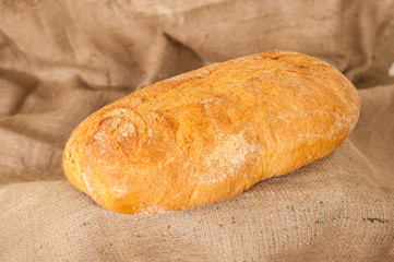 white bread on burlap background