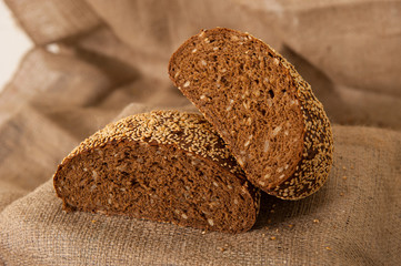 rye black bread on burlap background