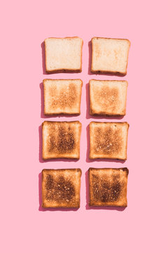 Set Of Eight Slices Toast Bread Isolated On Pink Background