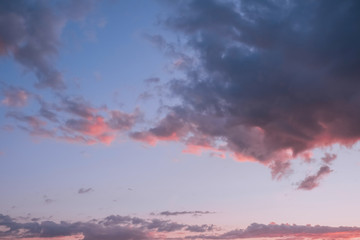 Colorful clouds on sunset sky, nature background