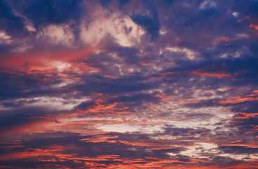 Naklejka na ściany i meble Colorful clouds on sunset sky, nature background