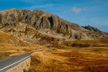 Road in the mountains. Beautiful view of Col de la Lombarde or Colle della Lombarda in the Alps on the border between France and Italy. Landscape at sunset