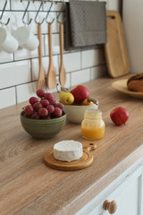 Cheese, honey and fruit on the kitchen table,healthy breakfast