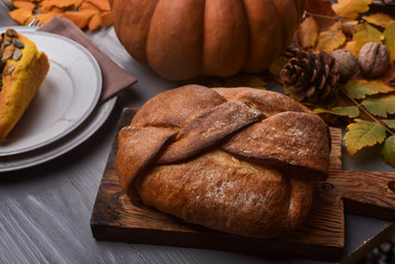 Whole grain bread and pumpkin on a festive autumn table