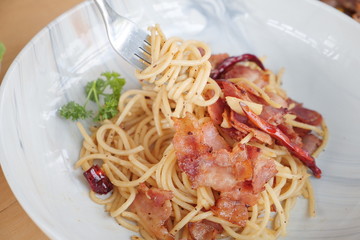 spaghetti with bacon sauce and basil