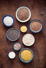 Fototapeta na wymiar Various organic cereals and grains in different bowls