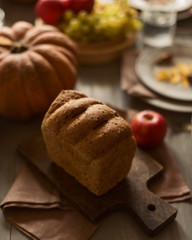 Fototapeta na wymiar Whole grain bread on a festive autumn table