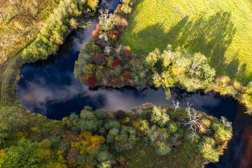 Latvian autumn nature. VIew from the top. Forest and river Jugla.