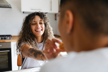 Two lovers having fun together for breakfast