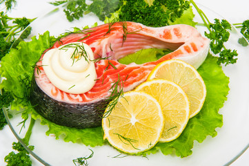 Salmon fish with lemon on lettuce