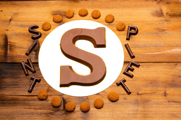 Celebration of Saint Nicholas, patron saint of children in Netherlands, Belgium, Luxembourg and North of France in first week of December, chocolate letters S and names of Sint and Piet