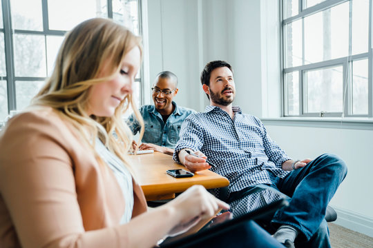 Coworkers in board room during meeting