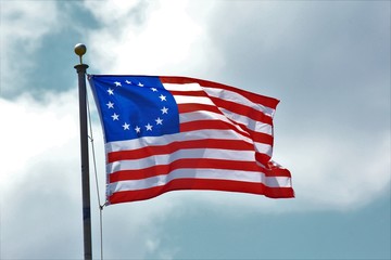 american flag of united states of america with 13 Stars and sky.
