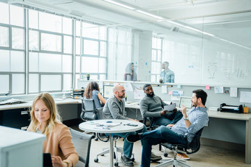 Men having meeting in office