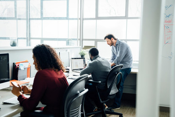 Workers by window in office