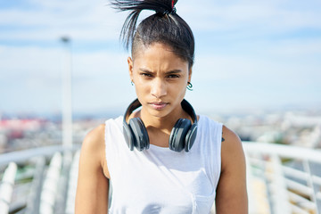 Portrait of a young attractive and fit woman during an urban workout