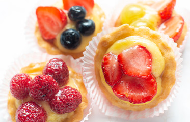 cupcakes with fresh seasonal fruit. Fresh fruit tart with cream and jelly