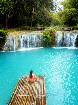 Woman in Cambugahay Falls in Siquijor, Philippines