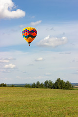 Balloons fly high above the fields.