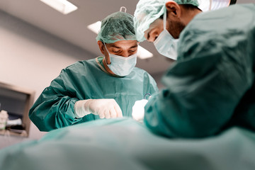 Team of Surgeons Operating in the Hospital