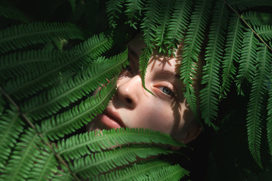Woman Standing Amongst Leaves