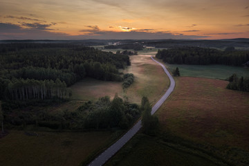 Aerial view of foggy rural fields at sunset
