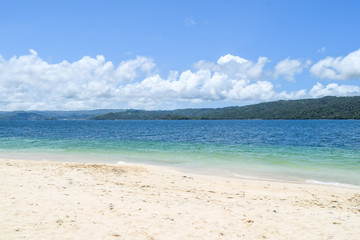 island in the carribean sea with white beach