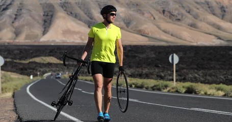 Bike repair cyclist man on side of road repair road bicycle problem with wheel. Cycling outdoor athlete biker biking with cycle waiting for team support car with bike mechanic - Powered by Adobe