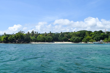 island in the carribean sea with white beach