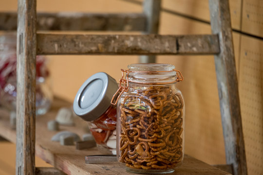 Heart-shaped salt pretzels in a glass for a snack - Powered by Adobe
