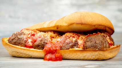 Unique submarine sandwich with tomato sauce bleeding out