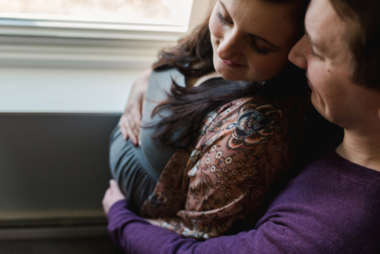 affectionate couple expectant first child