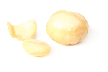 Macadamia nut with pieces isolated on a white background