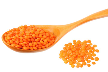 Pile lentil in wooden spoon isolated on white background