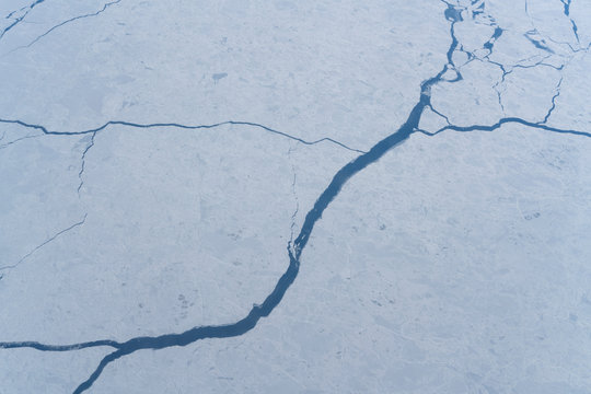 Icy lands from above with river