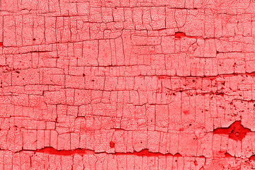 Old painted red boards for use as a background. Colored wooden background with cracked paint. Peeling paint on wall seamless texture. Pattern of rustic blue grunge material.