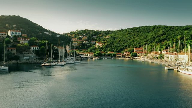 Low altitude aerial shot of Kioni Bay of Ithaca island, Greece