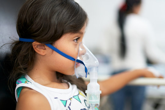 Hospitalized young girl receiving respiratory care