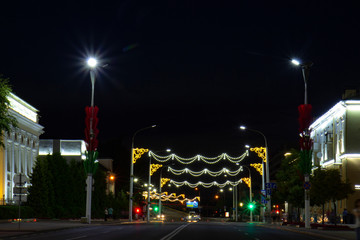 Fototapeta na wymiar Evening illumination of a city street.