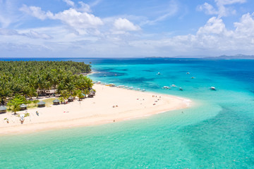 Seascape with a beautiful island. Daco island, Philippines. Tropical island with a white sandy beach for tourists. Island to relax.