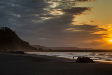 Naklejka na ściany i meble Sunset on Asturias beach.