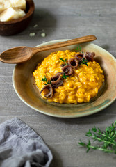 Pumpkin risotto with anchovies and thyme 