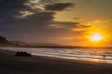 Obraz premium Sunset on Asturias beach. Clouds over the Cantabrian Sea