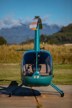 Front view of turquoise helicopter