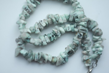 Handmade rude natural stone amazonite beads isolated on white background