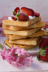 Waffles with strawberries and whipped cream