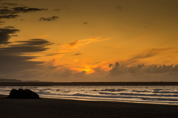 Sunset on Asturias beach. Clouds over the Cantabrian Sea