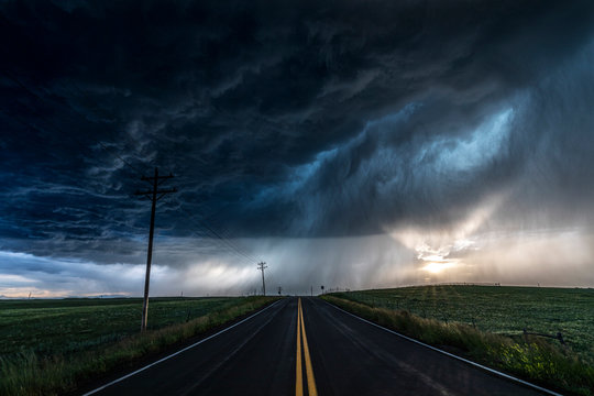 Heavy Storm And Rain With Road And Green Fields