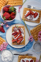 Homemade belgian Waffle. Strawberies and whiped cream.