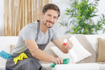 man with apron working at home